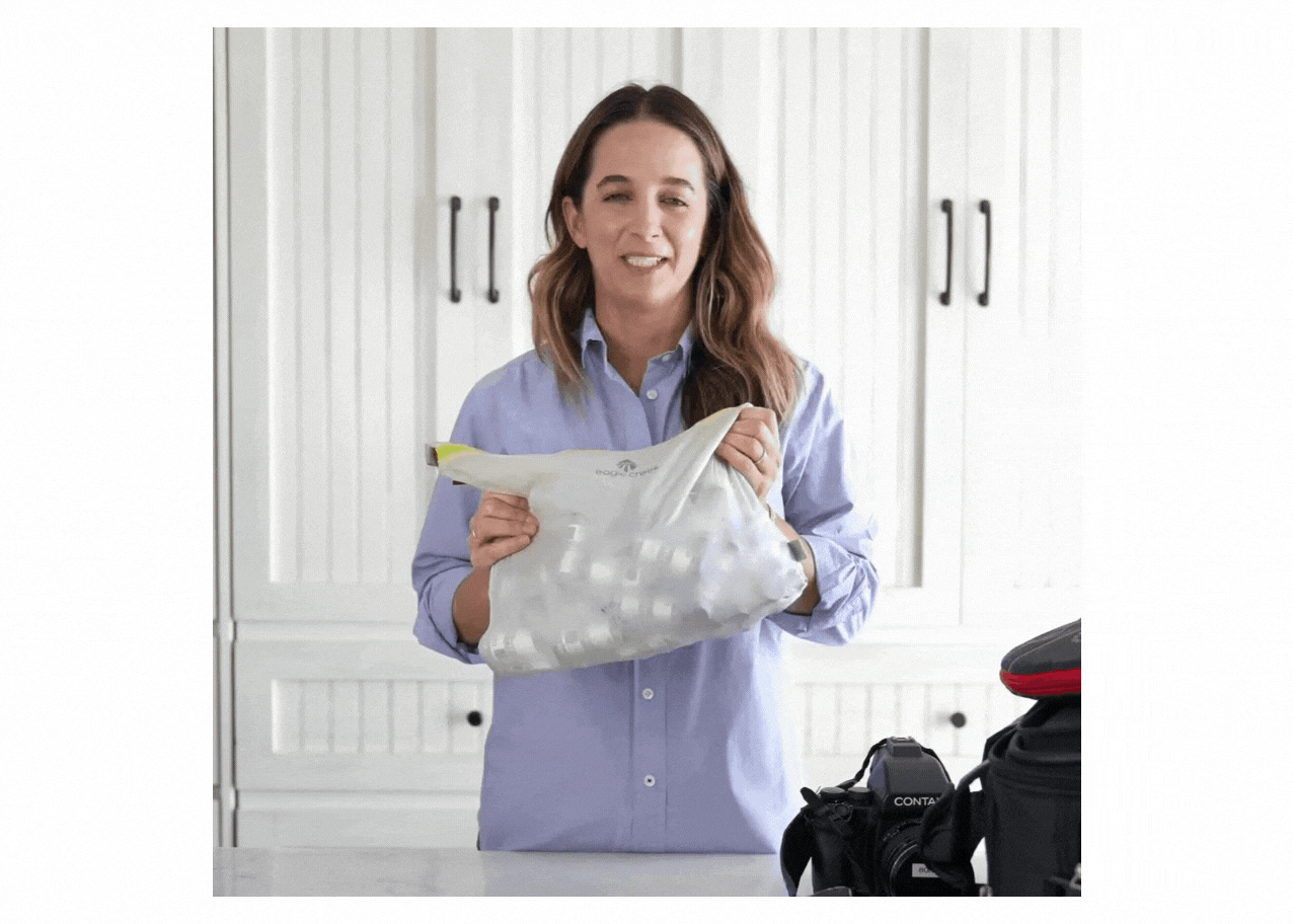 Gif of KT holding a large bag of photography gear, saying: "This will be for a big job".